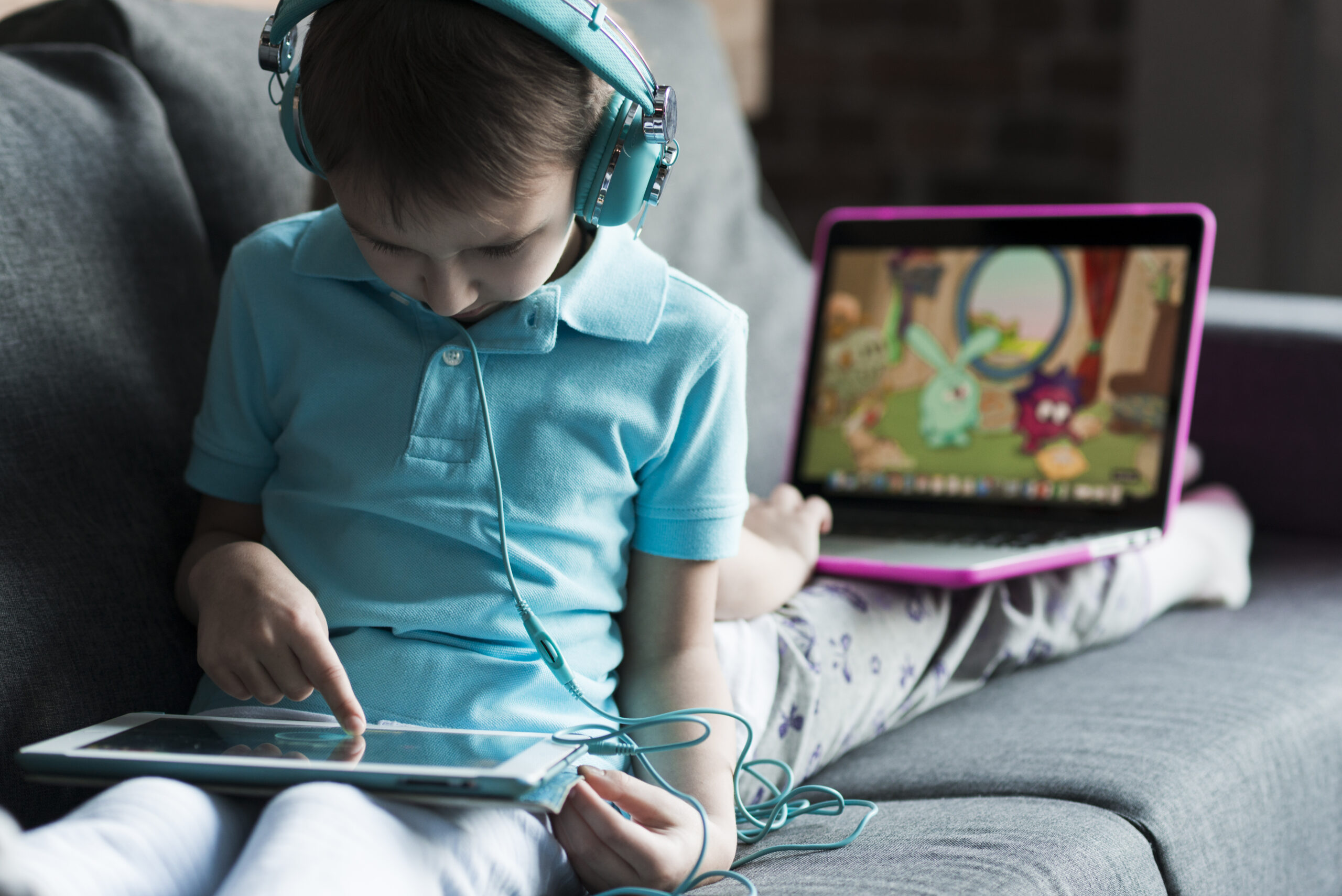 two kids with laptop tablet